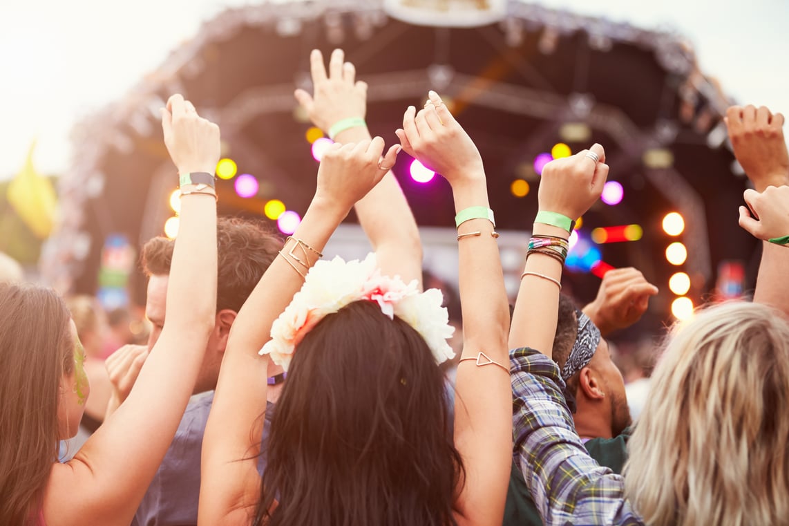 bigstock-Audience-with-hands-in-the-air-96657887