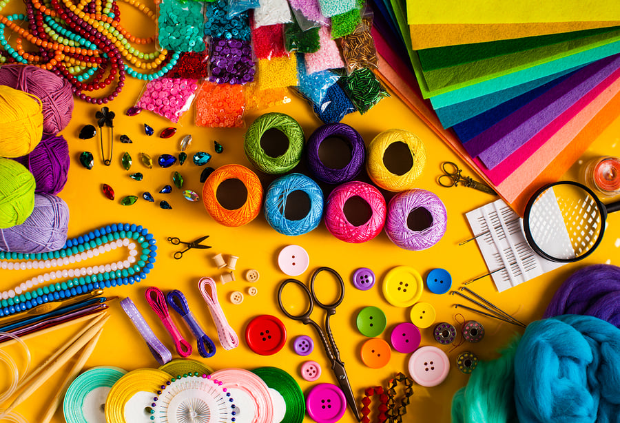 craft supplies on a yellow table
