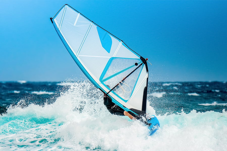 bigstock-Summer-Sports-Windsurfer-Ridi-302375614
